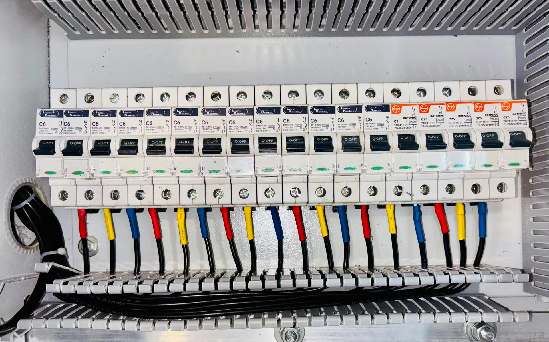 Tripped breaker switch in the off position in a gray electrical panel - ac circuit breaker keeps tripping what it means