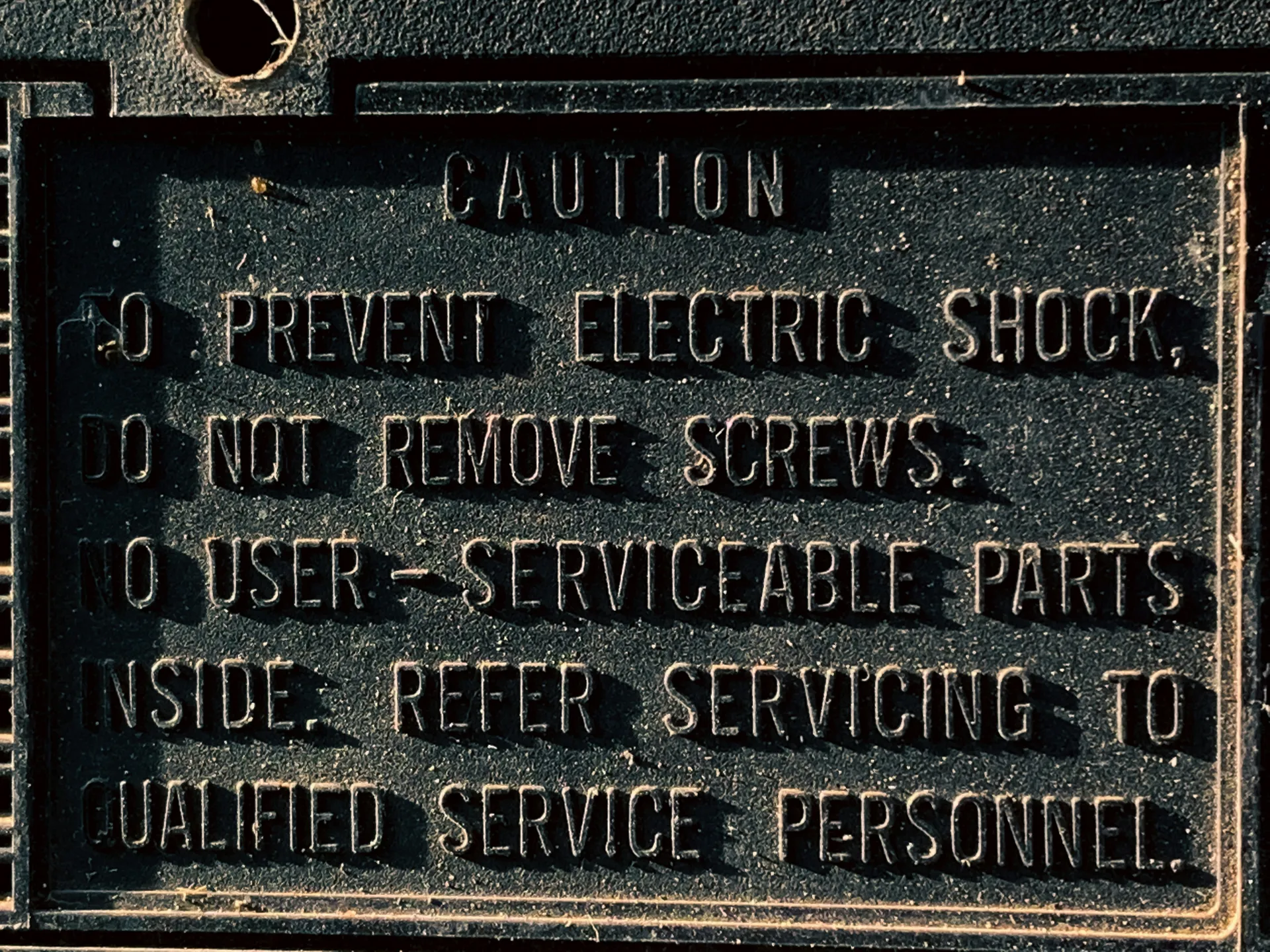 Close-up of a manufacturer data plate on an HVAC unit showing serial and model numbers - signs your systems need replacing