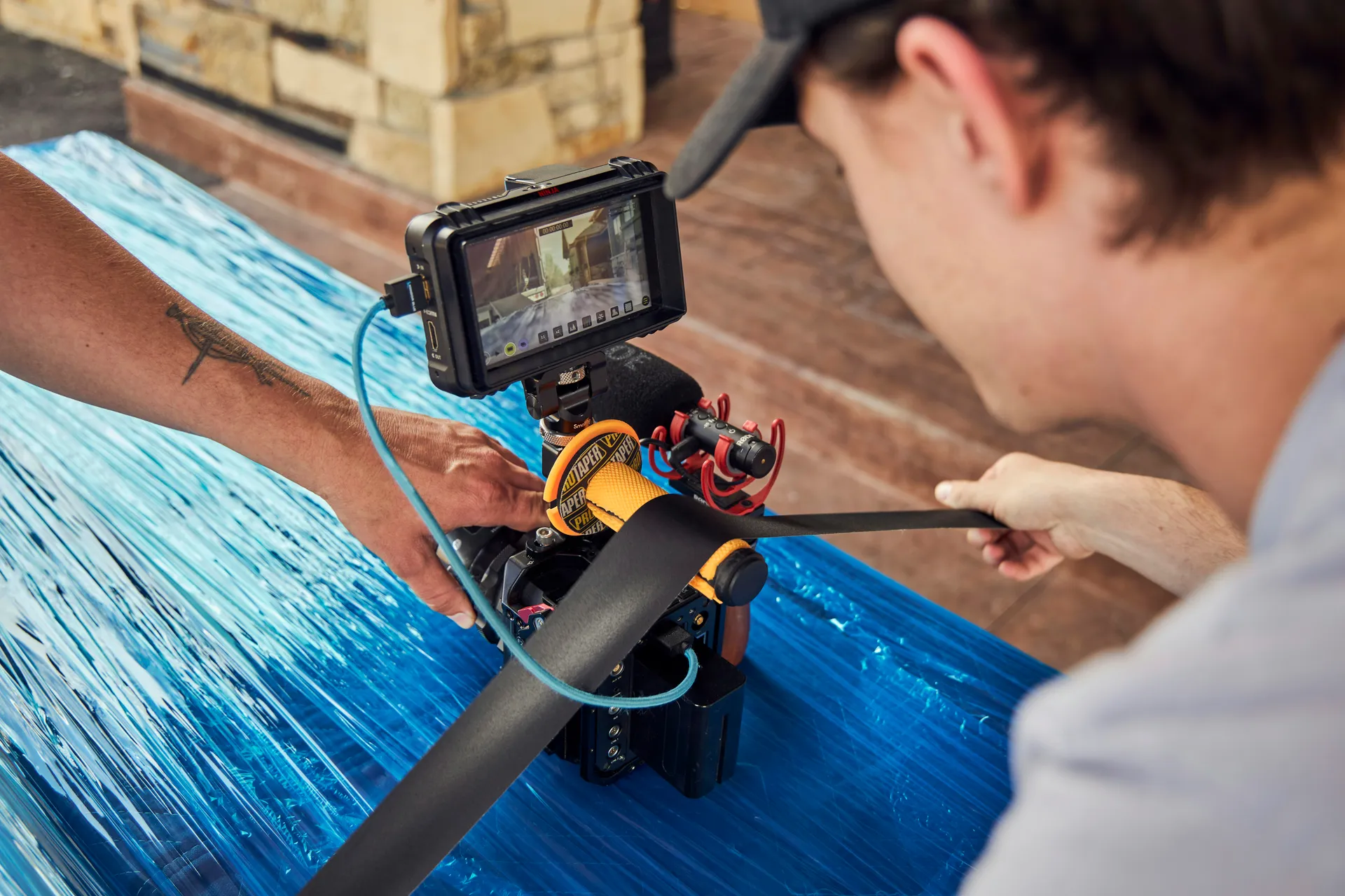 Professional plumber using a sewer camera reel and monitor to inspect a residential line