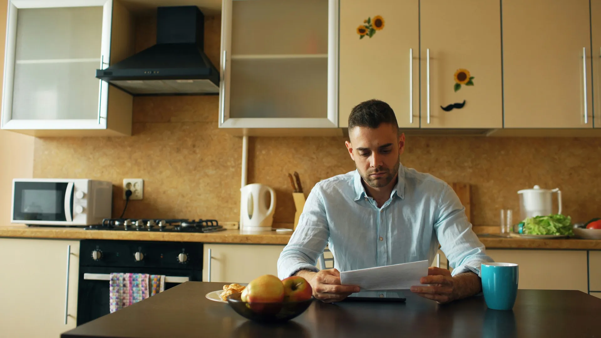 homeowner looking concerned while reviewing a service report with a technician - how old is too old for hvac and plumbing